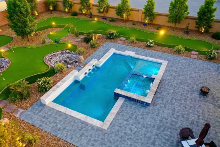 Backyard pool with spa and putting green